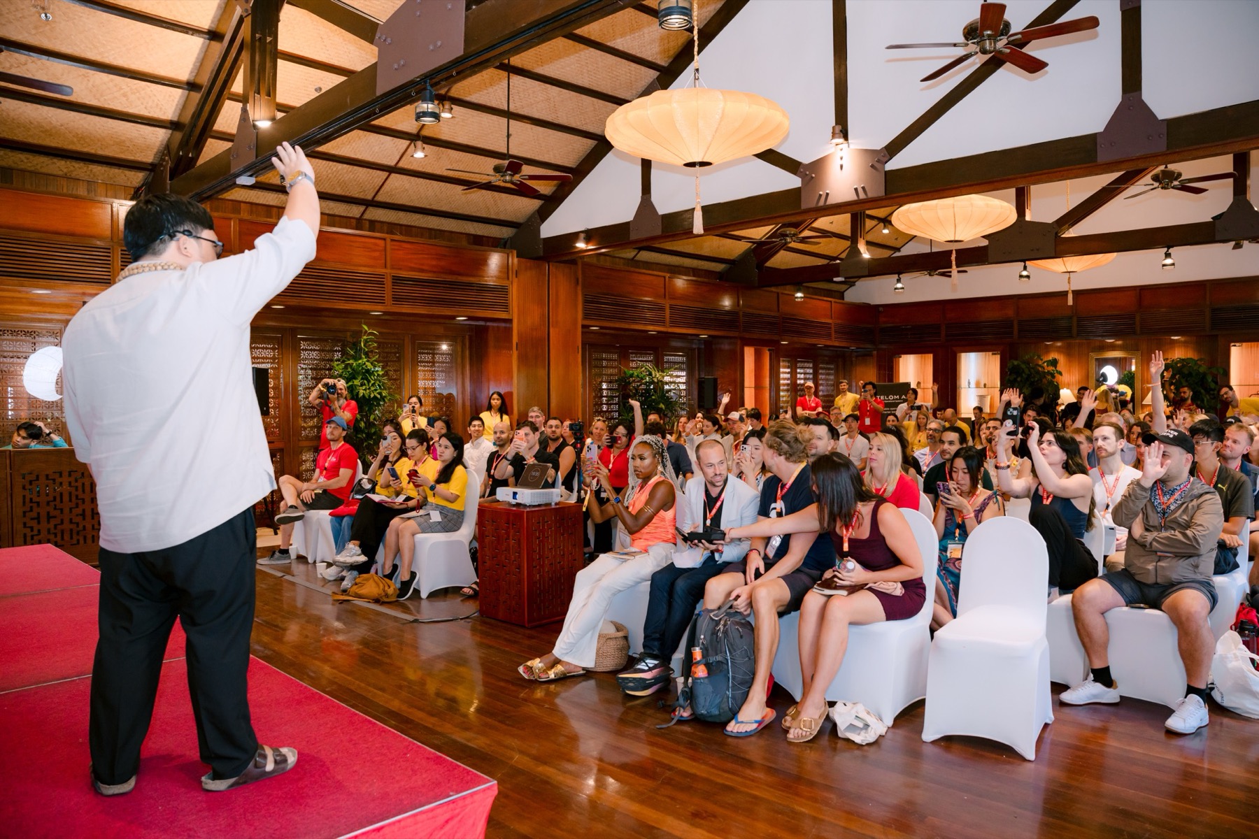 Cris Vinson on stage in front of a packed room